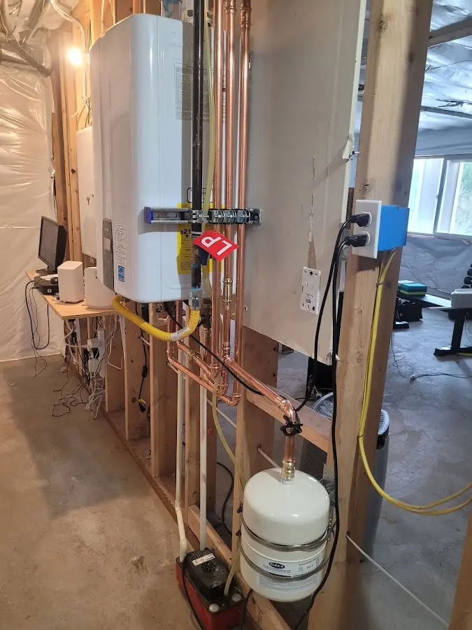 Licensed plumber repairing a kitchen sink in Chesterfield
